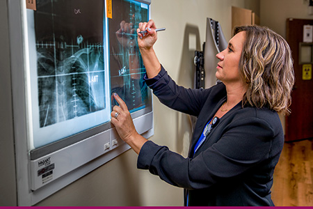 Deanna Salo looking at a an xray